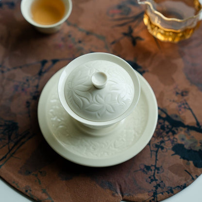 Ding Kiln Magnolia Pattern Ceramic Tea Cup with Saucer
